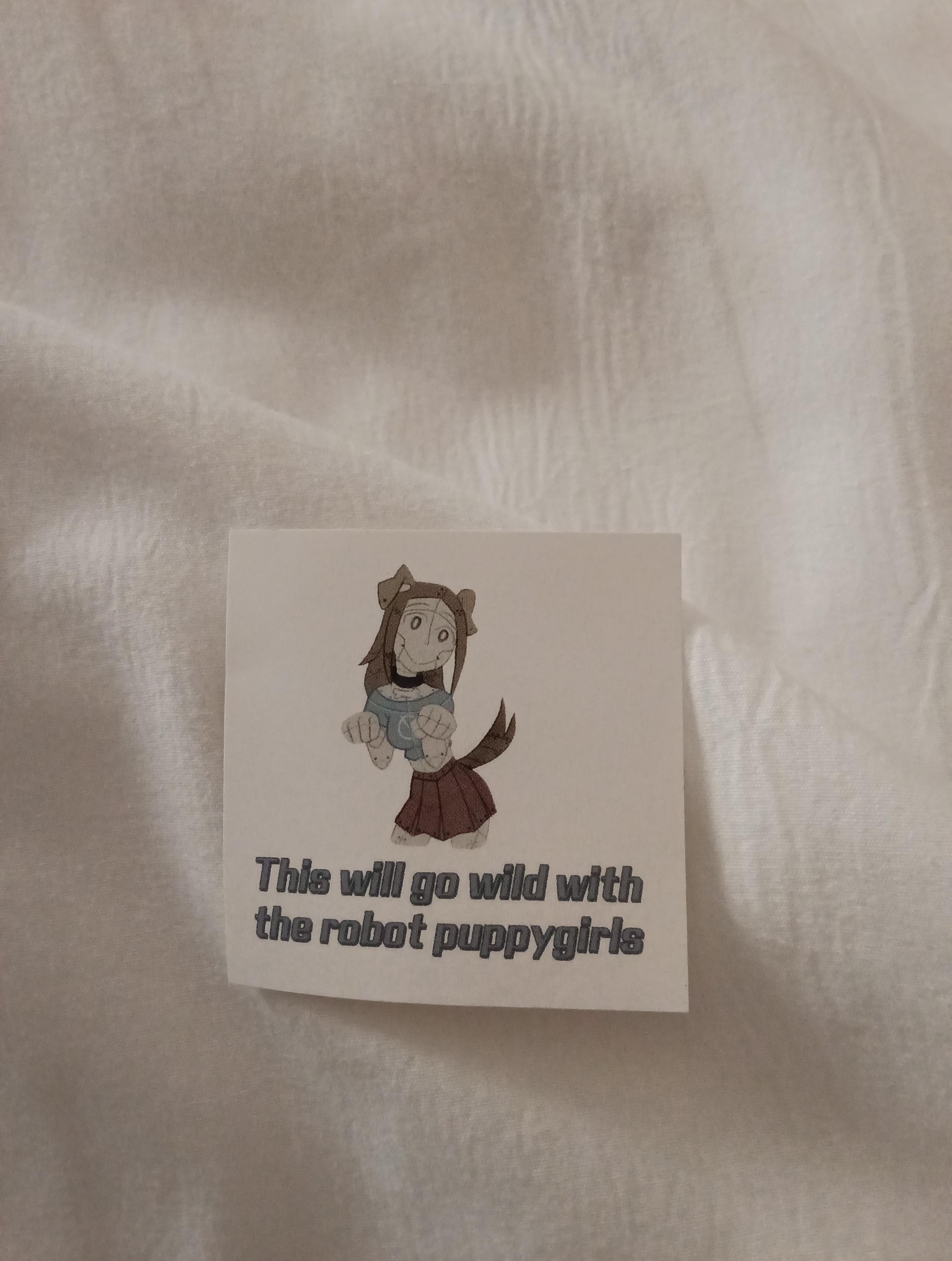 Sticker showing a puppygirl made of metal. Text under it says "this will go wild with the robot puppygirls"
